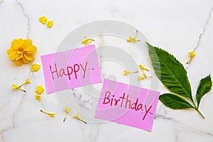 Happy birthday message card handwriting with yellow flowers cosmos