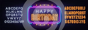 Happy birthday neon sign. Greeting card on brick wall background.