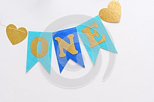 Happy Birthday One Year Flag Garland on white wall. One Year Party Banner Kids First Year.