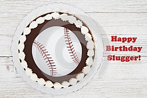 Happy Birthday Slugger baseball cake on a weathered whitewash wood photo