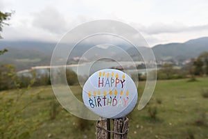 Happy Birthday stone with Turano lake background, Italy photo