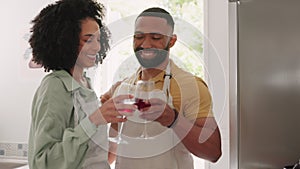 Happy black couple, kitchen and wine toast while cooking with love, hug and smile in home together. Happy couple, black