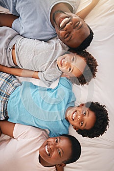 Happy black family, bed portrait and top view with happiness, kids and together with dad, mom and love. African children