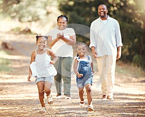 Happy, black family and children running in nature park in summer as mom and dad cheer their young African kids on