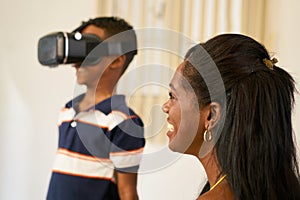 Happy Black Family Playing With Virtual Reality Goggles VR Heads