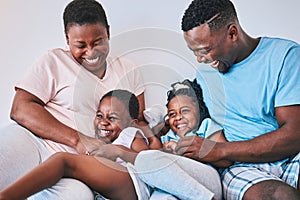 Happy, black family and tickle in a bed with smile, care and laugh on the weekend in their home. Bond, playing and