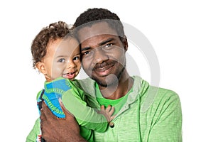 Happy black father and baby boy cuddling on isolated white background Use it for a child, parenting or love