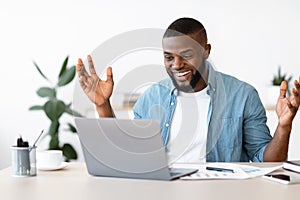 Happy Black Freelancer Man Celebrating Success While Working Online On Computer