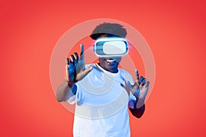 Happy black guy using VR headset, virtual reality concept