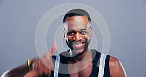 Happy black man, thumbs up and good job for winning or success isolated against a studio background. Portrait of excited