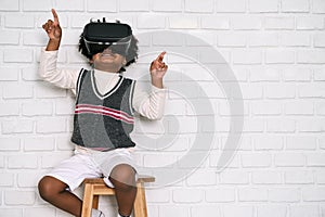 Happy black people African American child play VR at home