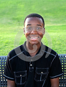 Happy Black Teen Boy Outside photo