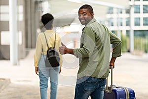 Happy Black Tourists Couple Gesturing Thumbs Up Walking To Airport