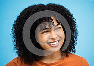Happy, black woman or afro hairstyle on isolated blue background with keratin treatment, self love or healthcare