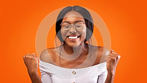 Happy Black Woman Gesturing Yes Over Orange Studio Background, Panorama