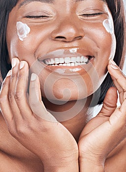 Happy black woman, skincare and facial treatment with cream for beauty, hydration or moisturizer Closeup or face of