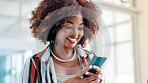 Happy, black woman and typing with phone at office for communication, social media or networking. Face of African female