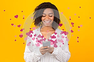 Happy black woman using online dating service