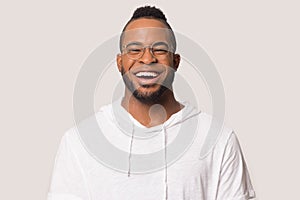 Happy black young man laugh isolated on grey background