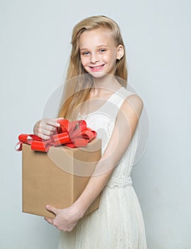 happy blond girl. natural makeup. beauty hairdresser salon. happy birthday. girl with big birthday present. gift box