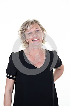 Happy blond senior woman smiling standing at isolated white background