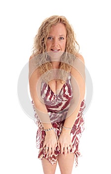 Happy blond woman bending forwards. photo