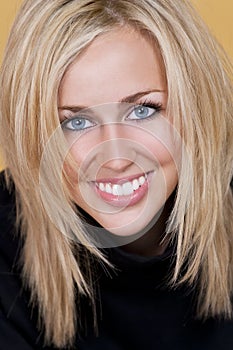 Happy Blond Woman With Perfect Teeth and Smile