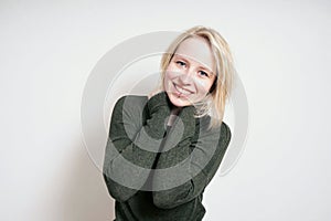 Happy blond young woman with big toothy smile