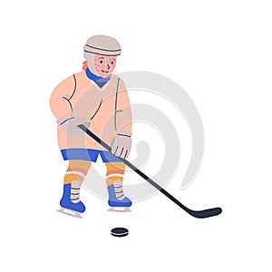 Happy blonde boy playing ice hockey game