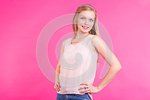 Happy Blonde Woman on pink background. Smiling Fashion Model with Hairstyle