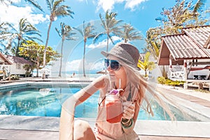 Happy blonde woman on tropical background. Vacation, summer. Healthy lifestyle.