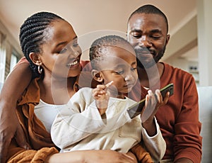 Happy, bonding and family time with a black family on a video call. Young parents being affectionate with their baby