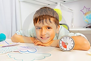 Happy boy during ABA therapy and lesson timer photo