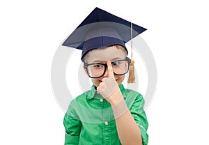 Happy boy in bachelor hat and eyeglasses