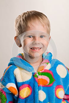 Happy boy in bathrobe