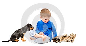 Happy boy with cat and puppy