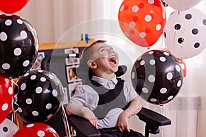 Happy Boy with cerebral palsy celebrates his birthday