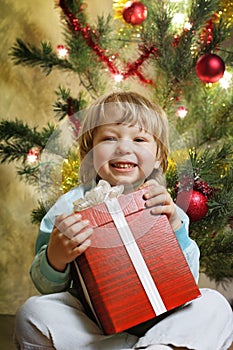 Happy boy with christmas gift