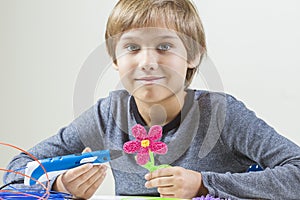 Happy boy creating with 3D pen