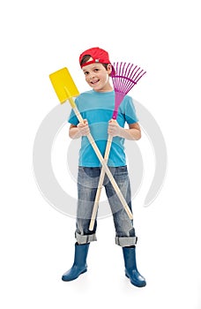 Happy boy with gardening tools
