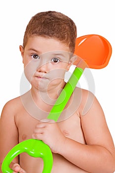 Happy boy with gardening tools
