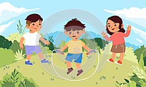 Happy boy and girl children playing jump rope in a green and sunny hill field