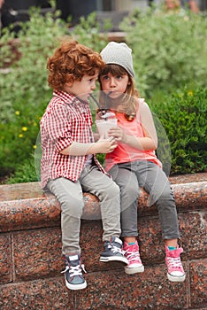 Happy boy and girl with coctail