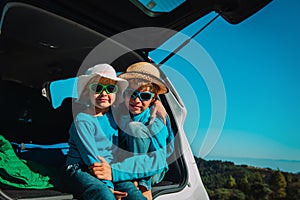 Happy boy and girl enjoy travel by car, family vacation