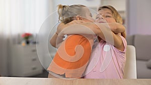 Happy boy and girl hugging, brother sister closeness, tender family relations