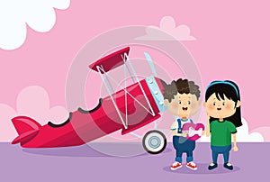 Happy boy and girl over light aircraft and pink background