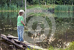 Happy boy go fishing on the river, one children fisherman with a
