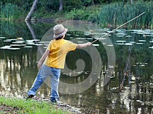 Happy boy go fishing on the river, one children fisherman with a