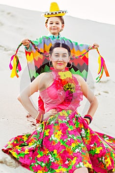 Happy boy and his mother wearing Mexicans