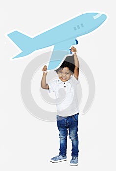 Happy boy holding an airplane icon